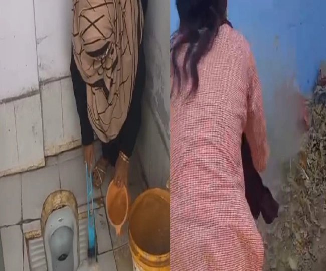 teacher cleaning toilet in government school